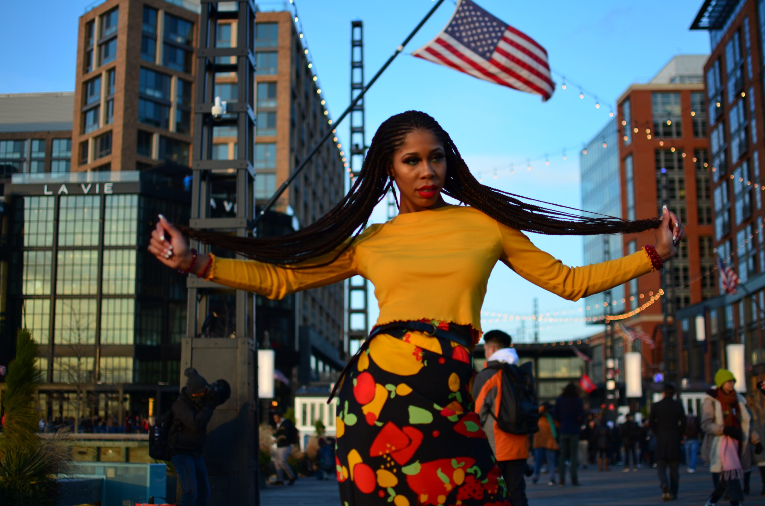 Woman boldly poses in front of American flag